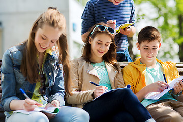 Image showing group of students with notebooks at school yard