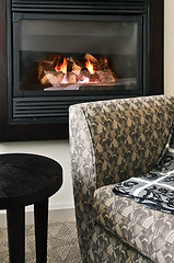 Image showing Fireplace and armchair