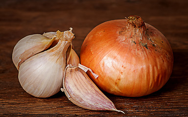 Image showing Onion and garlic on wooden table