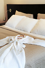 Image showing Hotel bed with bathrobe
