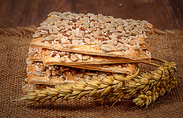 Image showing Cookies with cereals and wheat ears on sacking