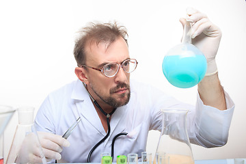 Image showing Mad chemist in the lab doing reaction