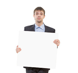 Image showing sad businessman holding a white blank