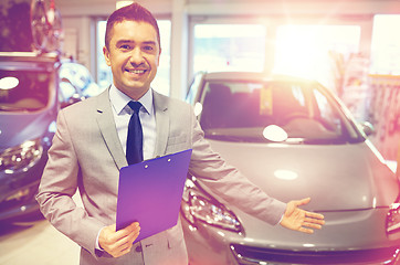 Image showing happy man at auto show or car salon