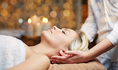 Image showing close up of woman having face massage in spa