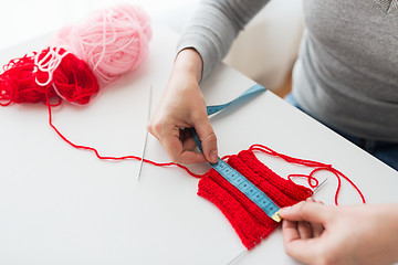 Image showing woman with knitting, needles and measuring tape