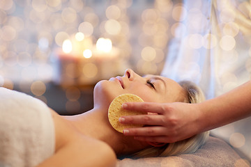 Image showing close up of woman having face massage in spa