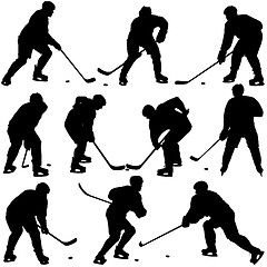 Image showing Set of silhouettes of hockey player. Isolated on white. 