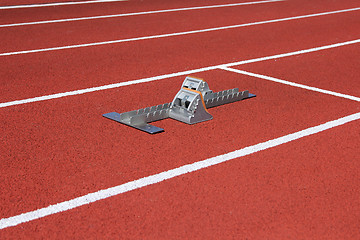 Image showing Athletics starting blocks on race track