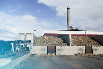 Image showing bio power plant with storage of wooden fuel (biomass) against bl