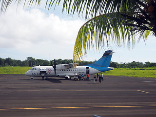 Image showing editorial tourist leaving plane Corn Island Airport Nicaragua