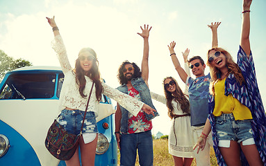 Image showing smiling hippie friends having fun over minivan car