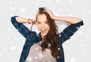 Image showing happy smiling pretty teenage girl over snow