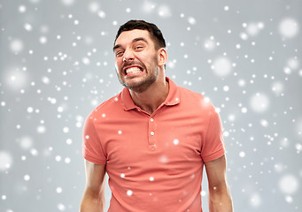 Image showing angry man over snow