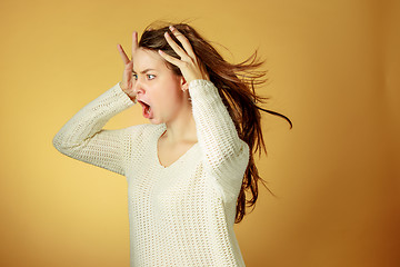 Image showing Portrait of young woman with shocked facial expression