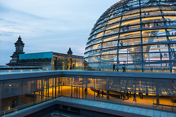 Image showing Illuminated glass dome on the roof of the Reichstag in Berlin at dusk.