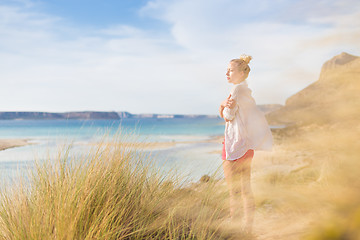 Image showing Free Happy Woman Enjoying Last Autumn Sun on Vacations.