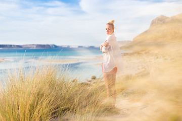 Image showing Free Happy Woman Enjoying Last Autumn Sun on Vacations.