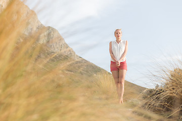 Image showing Free Happy Woman Enjoying Last Autumn Sun on Vacations.