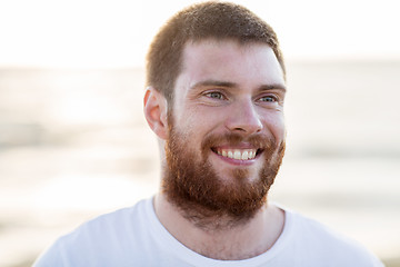 Image showing face of happy smiling young man outdoors