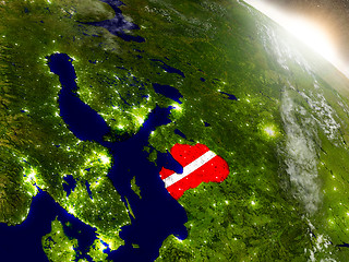 Image showing Latvia with flag in rising sun