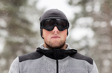 Image showing sports man with ski goggles in winter outdoors