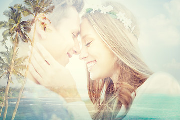 Image showing happy smiling young hippie couple over beach