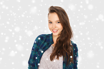 Image showing happy smiling pretty teenage girl over snow