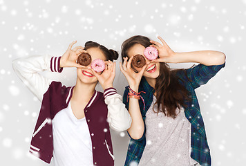 Image showing happy pretty teenage girls with donuts having fun