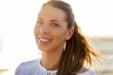 Image showing happy smiling young woman face outdoors