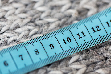 Image showing close up of knitted item with measuring tape