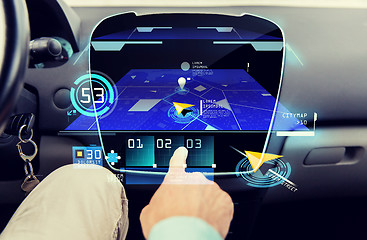 Image showing close up of man with gps navigator on car computer