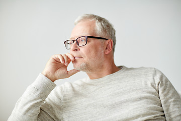 Image showing close up of senior man in glasses thinking