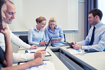 Image showing smiling business people meeting in office