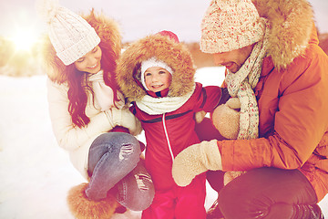 Image showing happy family with child in winter clothes outdoors