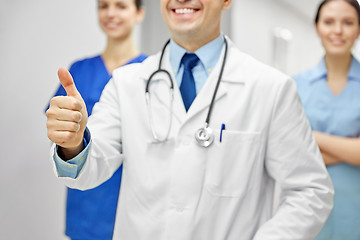 Image showing close up of doctors at hospital showing thumbs