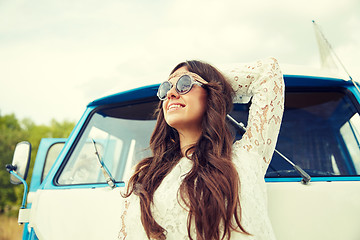 Image showing smiling young hippie woman in minivan car