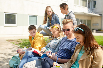 Image showing group of students with notebooks at school yard