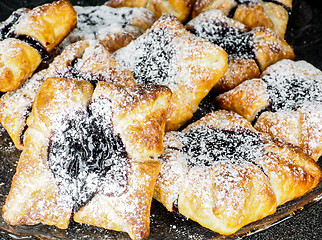 Image showing Danish pastry with blueberry jam filling with white powdered sug