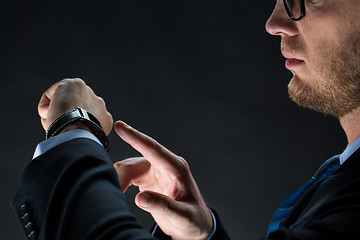 Image showing close up of businessman with smart watch