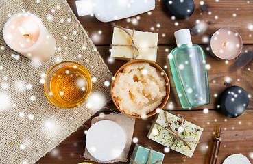 Image showing natural body care cosmetics on wood