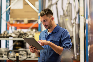 Image showing auto mechanic or smith with tablet pc at workshop