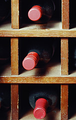 Image showing Cells with three wine bottles