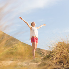 Image showing Free Happy Woman Enjoying Sun on Vacations.