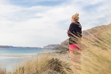 Image showing Free Happy Woman Enjoying Last Autumn Sun on Vacations.