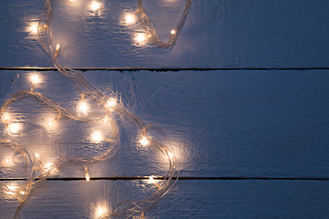 Image showing Garland on empty wooden floor