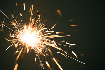 Image showing Christmas sparkler on black background