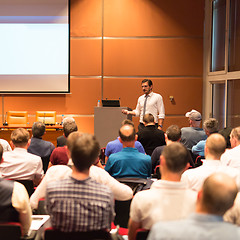 Image showing Business speaker giving a talk in conference hall.