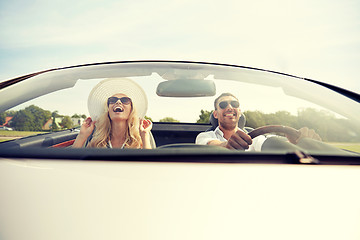 Image showing happy man and woman driving in cabriolet car