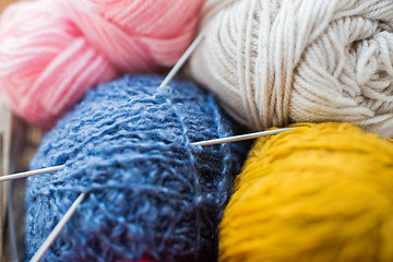 Image showing close up of knitting needles and yarn balls